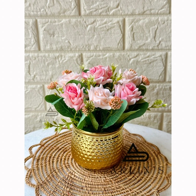 Flower setup on plastic golden vase